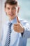 Unrecognisable business man with thumbs up gesture