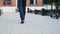 Unrecognisable businessman feet walking in the business district