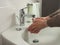 Unrecognisable man washing hands