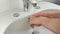 Unrecognisable man washing hands