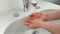 Unrecognisable man washing hands