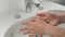 Unrecognisable man washing hands, close up