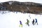 Unrecognisable people skiing on Mount Ruapehu