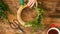 Unrecognisable woman making christmas wreath in living room. DIY Christmas decoration concept. Hands close up.