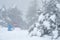 Unrecognised people play at snow during snowstorm in snow mountain in winter.