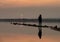 Unrecognised person standing and enjoying the sunset at a lake. Larnaca Cyprus