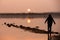 Unrecognised person standing and enjoying the sunset at a lake. Larnaca Cyprus