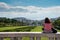 Unrecognised tourist woman looking at the cityscape of Lisbon in Portugal Europe