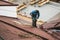 Unrecognised worker on modern roof, construction industry