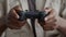 Unrecognizable African American Man Playing Videogame Holding Gaming Controller, Closeup