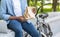 Unrecognizable Afro Man Holding Paper Package With Food, Eating Outdoors