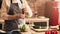 Unrecognizable Aged Woman Holding Pepper Mill Seasoning Vegetable Salad In Kitchen