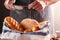 Unrecognizable baker finishing his pastry close-up