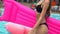 Unrecognizable beautiful happy young woman with pink mattress in summer. Bikini girl. young girl relaxing and