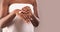 Unrecognizable Black Lady Wrapped In Towel Applying Hand Cream, Using Moisturising Lotion