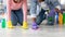 Unrecognizable black man and woman cleaning floor in living room