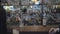 Unrecognizable brunette woman and blond bearded man sitting at the bar counter close up. Concept of night lifestyle