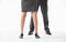 Unrecognizable business people\'s legs in conflicting pose