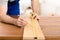 Unrecognizable Carpenter Measuring Wooden Board Making Furniture Indoor