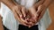 Unrecognizable Couple Holding New House Keys, Closeup Of Hands