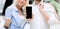 Unrecognizable Couple Showing Blank Phone Screen Posing In Mall, Panorama