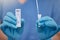 Unrecognizable doctor holding a covid test and a cotton swab while working alone at a hospital. One unrecognizable nurse