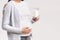 Unrecognizable Expectant Girl Holding Milk, Cropped, Studio Shot