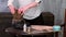 Unrecognizable female pottery artist preparing clay for molding in her workshop