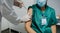 Unrecognizable female surgeon receiving coronavirus vaccine