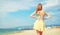 Unrecognizable female tourist enjoying seascape in summer