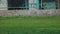 Unrecognizable girl kicks the ball in the stadium. Young woman.