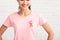 Unrecognizable Girl With Pink Ribbon On T-Shirt Posing, White Background