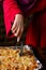 Unrecognizable girl takes piece of homemade pizza. Woman\'s hand with long nails holds kitchen spatula