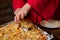 Unrecognizable girl takes piece of homemade pizza. Woman\'s hand with long nails holds kitchen spatula