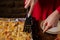 Unrecognizable girl takes piece of homemade pizza. Woman\'s hand with long nails holds kitchen spatula