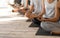 Unrecognizable Group Of People Practicing Yoga In Studio, Meditating In Lotus Position