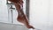 Unrecognizable Lady Shaving Legs Using Razor In Bathroom Indoor, Closeup