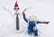 unrecognizable little boy in a winter polar bear hat and a snowman in a Santa hat, reindeer glasses and a New Year\\\'s tie