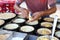 Unrecognizable man is cooking traditional Malaysian street food apam balik. Street market in Georgetown, Malaysia