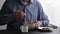 Unrecognizable man eating oatmeal porridge for breakfast