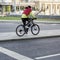 Unrecognizable man riding on the bike in the sity street. Healthy lifestyle, leisure activity