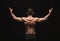 Unrecognizable man shows strong back muscles closeup