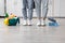 Unrecognizable man and woman cleaning kitchen together