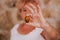 Unrecognizable middle age woman working with plants, holding a fresh tomato, gardening concept. environment protecting