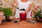 Unrecognizable middle age woman working with plants outdoors, gardening concept. Nature