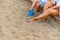 Unrecognizable mother and daughter enjoying in the beach