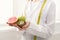 Unrecognizable nutritionist woman with fruits at office