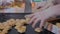 Unrecognizable Pastry Chef packing biscuits, cookies in industrial food factory. Cookies production line.