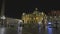 Unrecognizable people walking in St. Peter`s Square in the Vatican city in front of the facade of St. Peter`s basilica