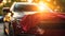 Unrecognizable person cleaning car with washcloth on a bright summer day in a wide shot